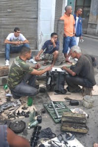 CAR REPAIR HAPPENS SPONTANEOUSLY IN HAVANA. WHERE EVER A CAR BREAKS DOWN ITS OWNER AND MECHANIC SITS DOWN WITH A BOOK AND RESTORES THE STATUS QUO...