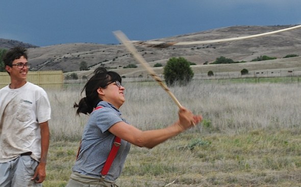 VICTORIA BOWLER shows ALEXANDAR BALLESTEROS how to throw ATLATL darts